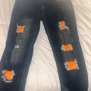 Distressed Jeans with Orange Accents